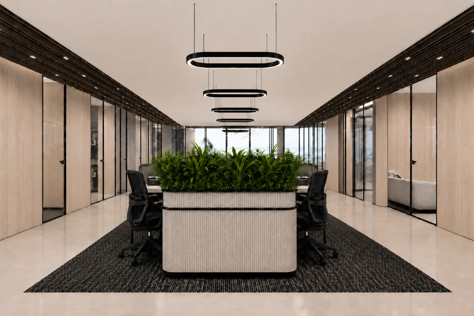 Open-plan executive meeting area with a central planter of lush green plants, surrounded by black office chairs and glass-walled offices along the sides.